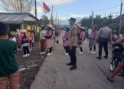 Polsek Wita Ponda Kawal Pawai HUT RI ke-80 di Desa Laantula Jaya